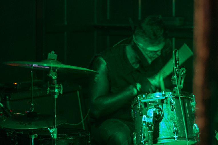 A person playing a drum set

Description automatically generated